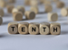 The word 'tenths' spelled by blocks