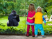 Children watching gorilla in a zoo
