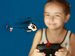 Child playing with model helicopter