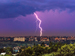 A bolt of lightning striking a city.