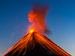 Volcanic eruption against blue sky