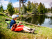 Teenage boy fishing by a river