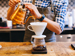 Man making filter coffee in a kitchen