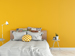 Modern bedroom with yellow walls