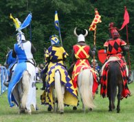 Men on horses reconstructing a historic battle